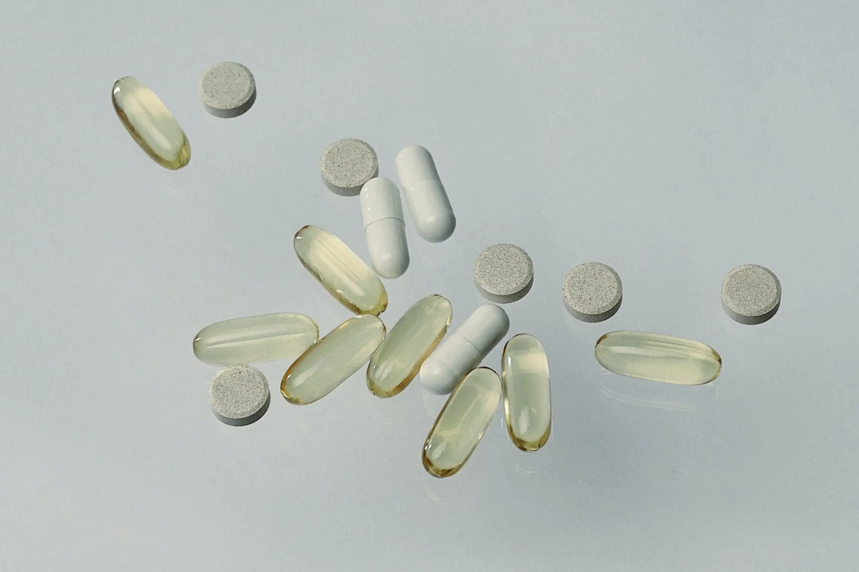 pills splayed across a grey background